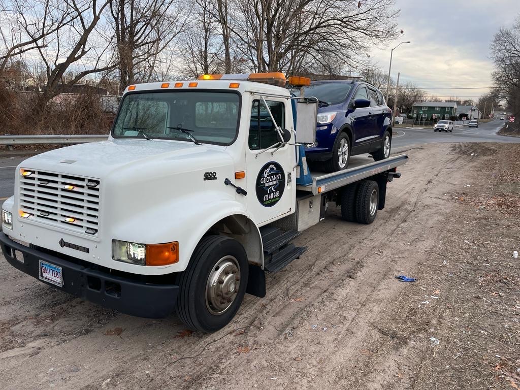 Flatbed carrier serving Danbury CT vehicle transport customers